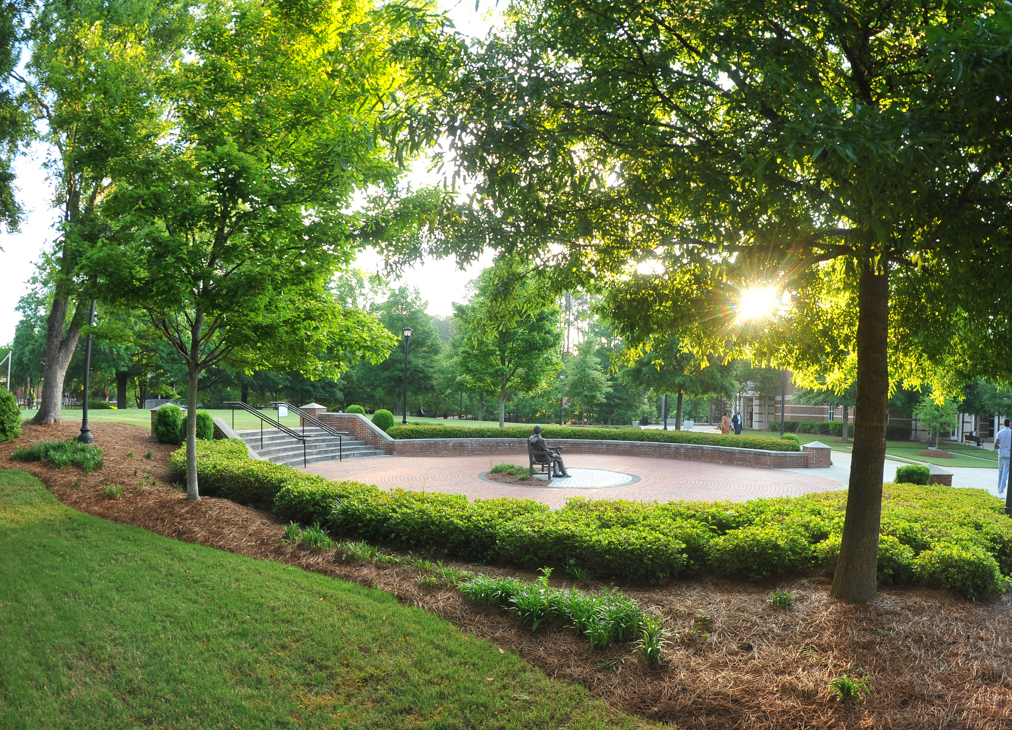 Atlanta campus landmark image with light filtering through trees.