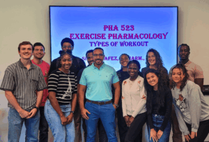 Dr. Sherif Hafez poses with the first students in his science of excercise class