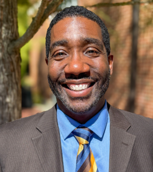 A headshot of a Christopher Weaver