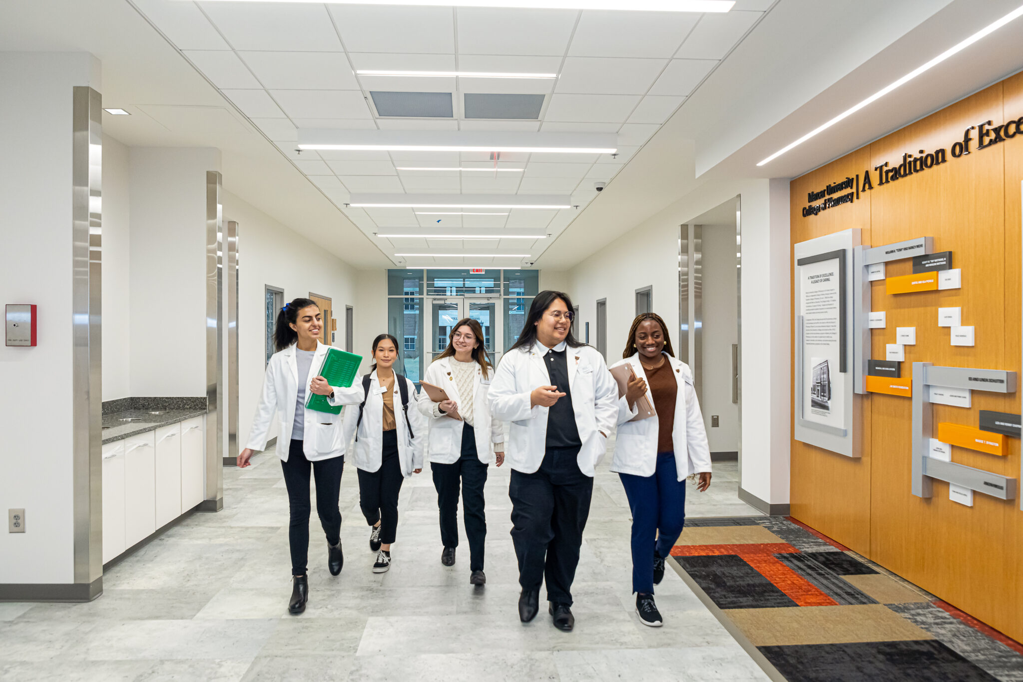 Students walking down the hallway of the Moye Health Sciences Center