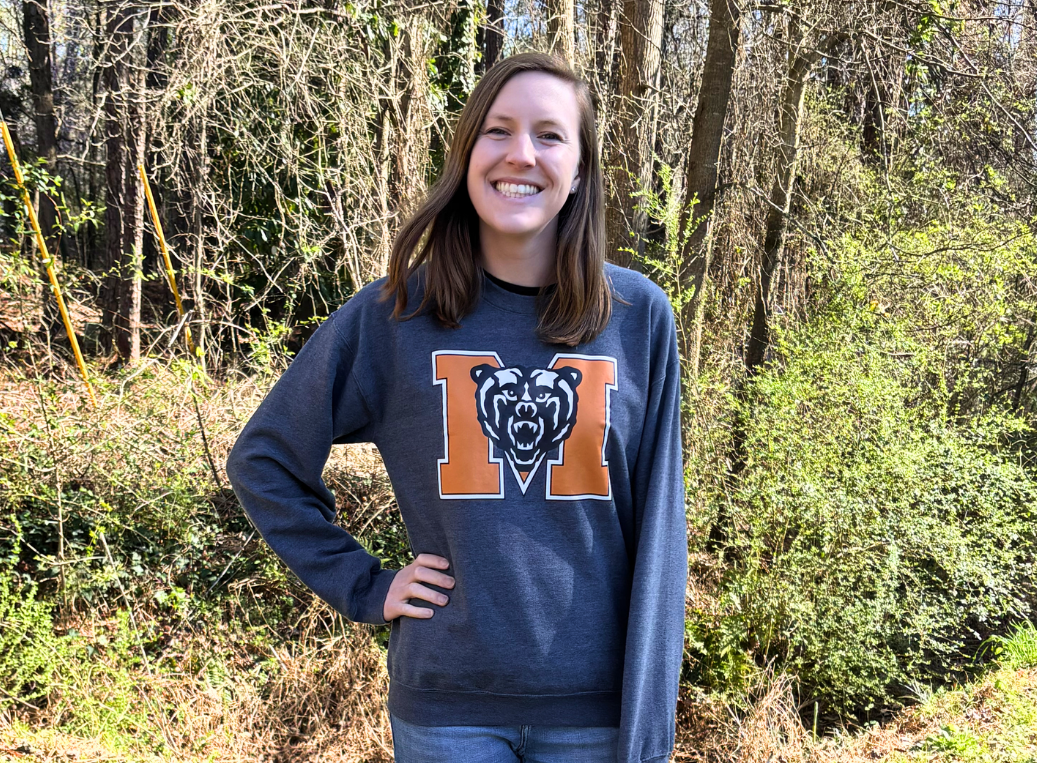 Carol Garrison in front of some trees on the Mercer Atlanta campus