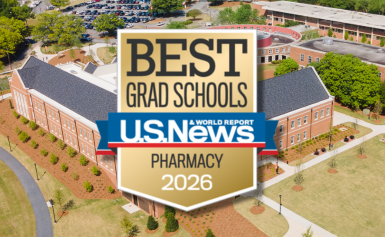 The US News and World Report best Pharmacy Grad School badge superimposed over a drone shot of the Mercer Pharmacy School