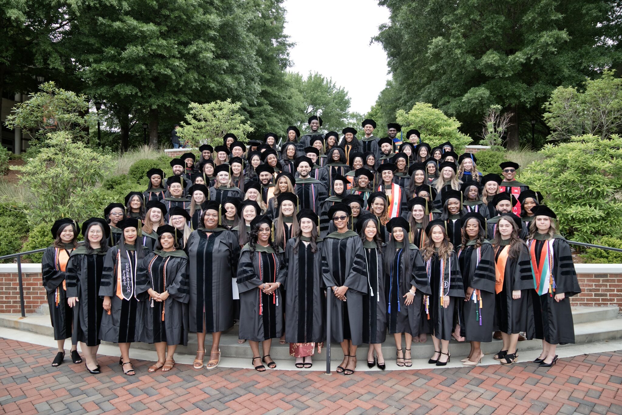 The graduating class of 2026 outside on the staircase on the campus of Mercer University